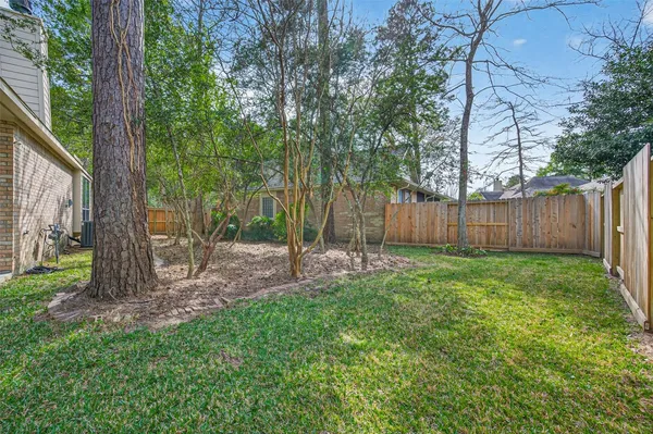 a view of a yard with tree s