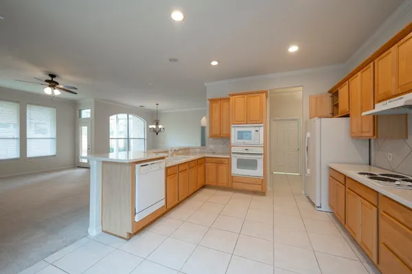a view of a kitchen with a sink cabinets and a window