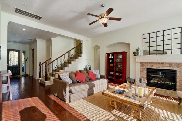 a living room with furniture fireplace and window