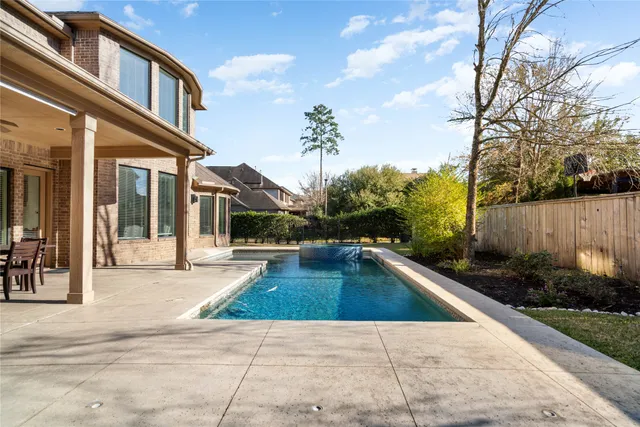 a view of a livingroom with furniture window and wooden floor