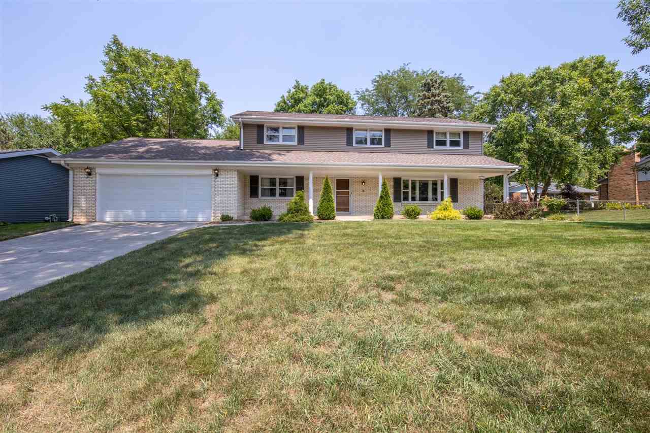 4960 Welsh Road Rockford, IL 61107 - Photo 1 of 39 a front view of a house with a garden