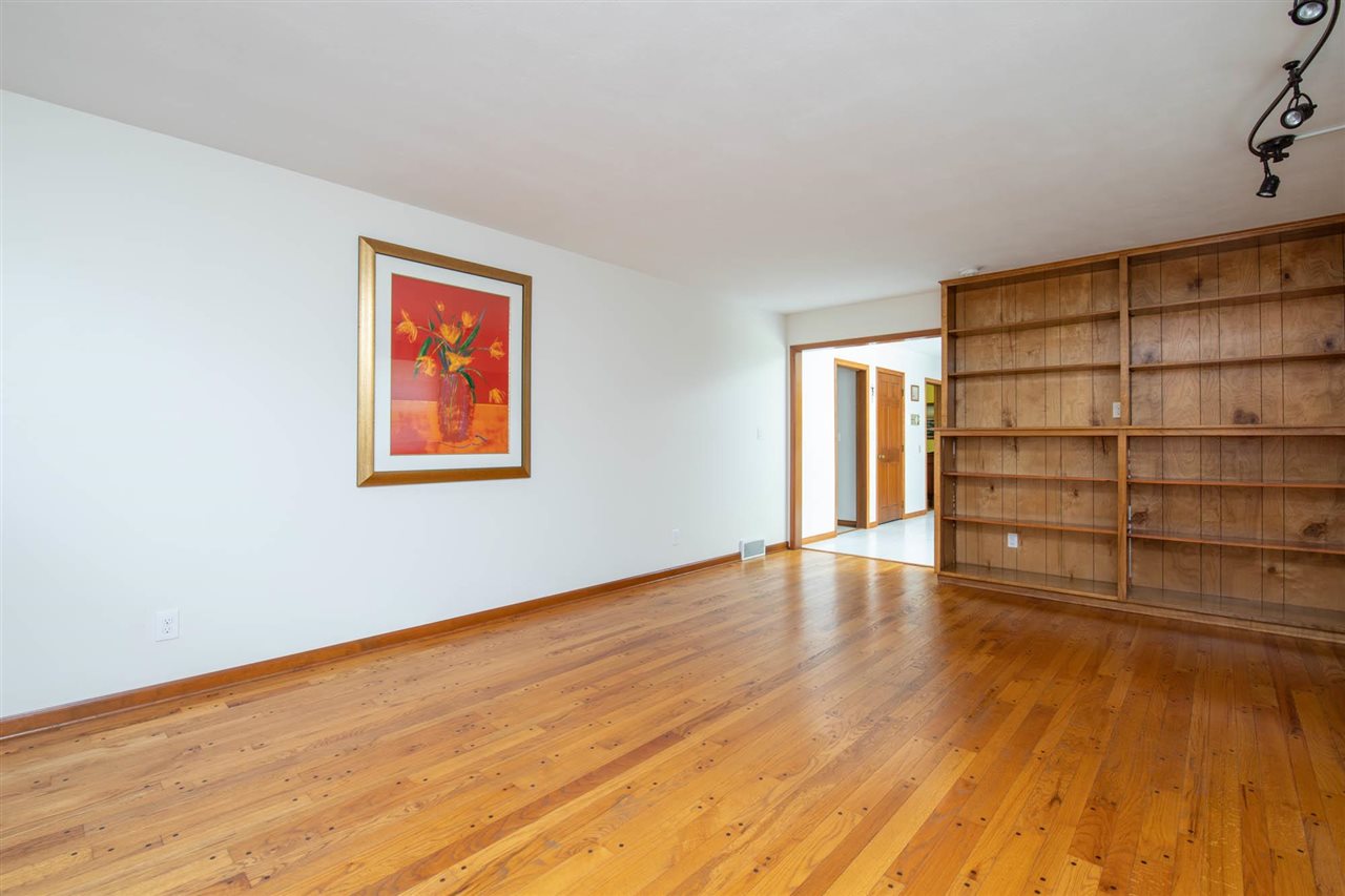 4960 Welsh Road Rockford, IL 61107 - Photo 11 of 39 a view of an empty room with wooden floor and closet