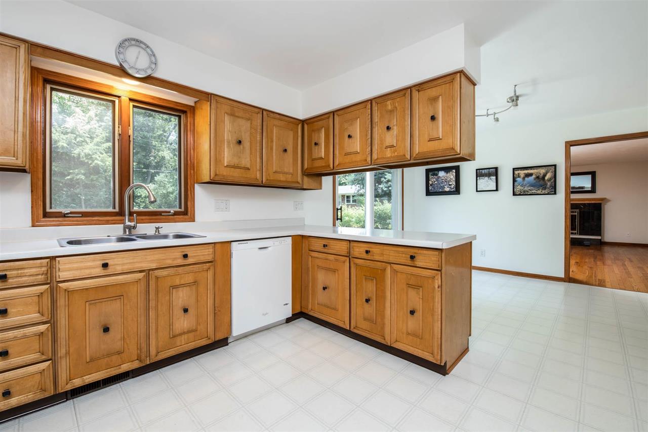 4960 Welsh Road Rockford, IL 61107 - Photo 13 of 39 a kitchen with stainless steel appliances granite countertop a stove a sink and a cabinets