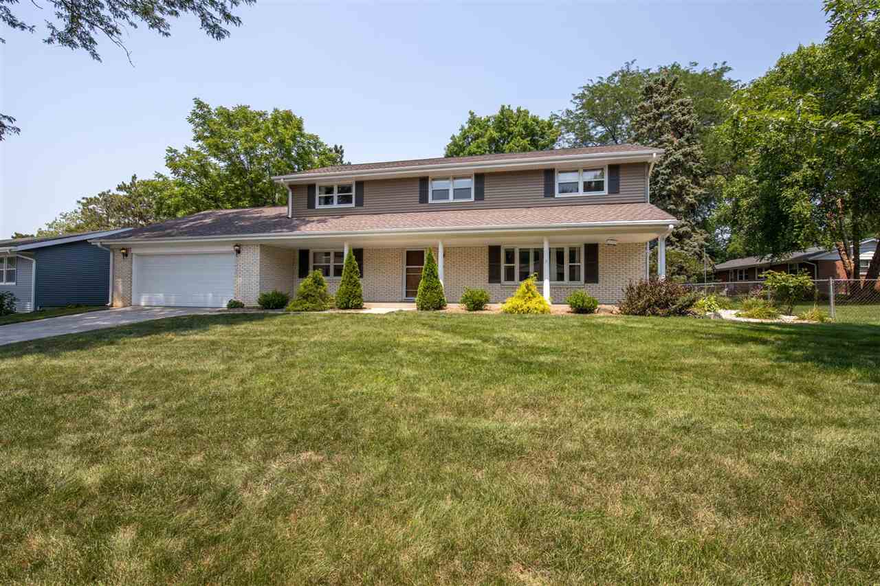 4960 Welsh Road Rockford, IL 61107 - Photo 2 of 39 a front view of a house with garden