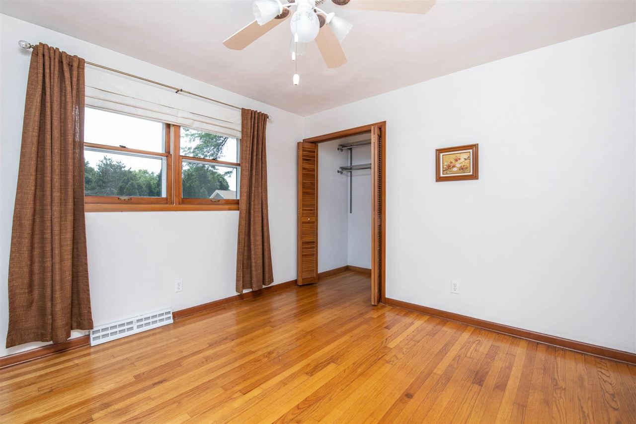 4960 Welsh Road Rockford, IL 61107 - Photo 30 of 39 a view of an empty room with wooden floor and a window