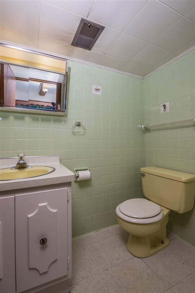 4960 Welsh Road Rockford, IL 61107 - Photo 35 of 39 a bathroom with a granite countertop toilet and a sink