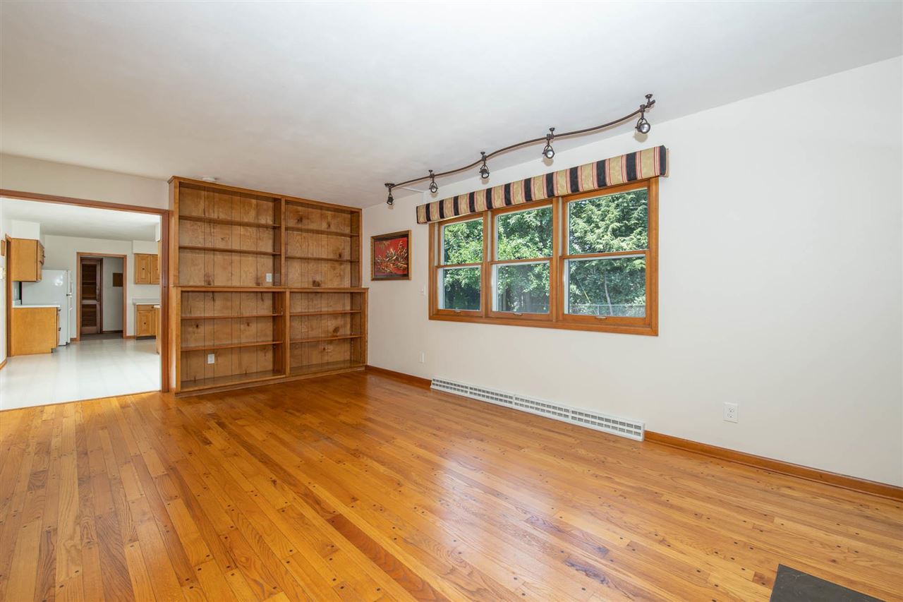 4960 Welsh Road Rockford, IL 61107 - Photo 10 of 39 wooden floor in an empty room with a window