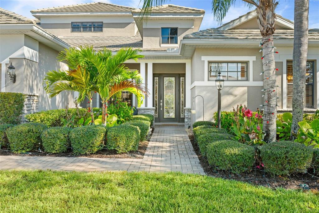 6470 Indigo Bunting Place Lakewood Ranch, FL 34202 - Photo 11 of 65 front view of a house with a yard