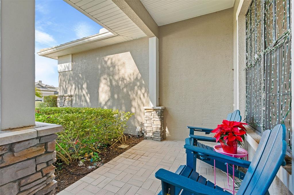 6470 Indigo Bunting Place Lakewood Ranch, FL 34202 - Photo 13 of 65 a living room with furniture and a potted plant