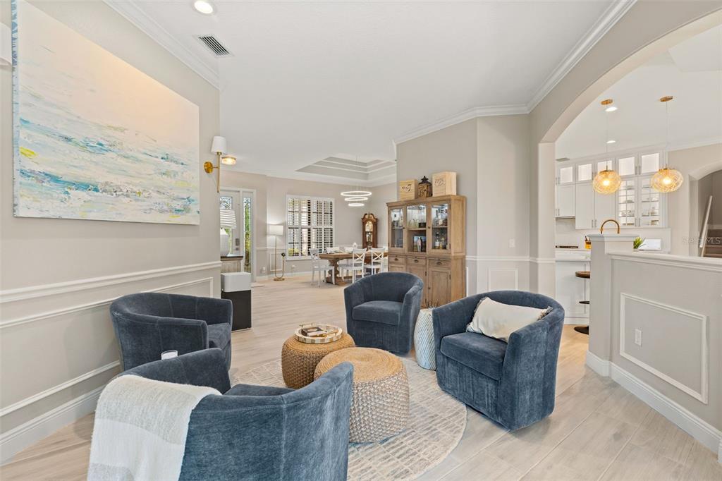 6470 Indigo Bunting Place Lakewood Ranch, FL 34202 - Photo 20 of 65 a living room with furniture and a large window