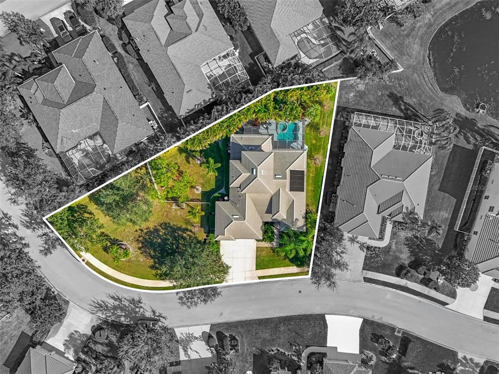 6470 Indigo Bunting Place Lakewood Ranch, FL 34202 - Photo 2 of 65 an aerial view of a house with a swimming pool