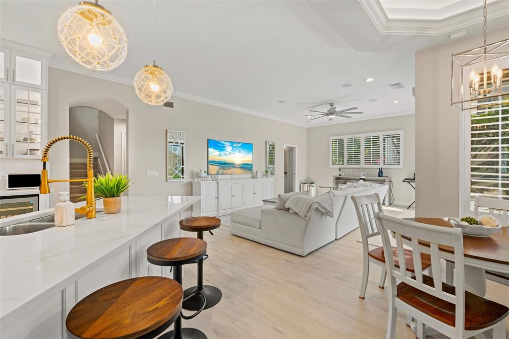 6470 Indigo Bunting Place Lakewood Ranch, FL 34202 - Photo 21 of 65 a living room with furniture and a large window
