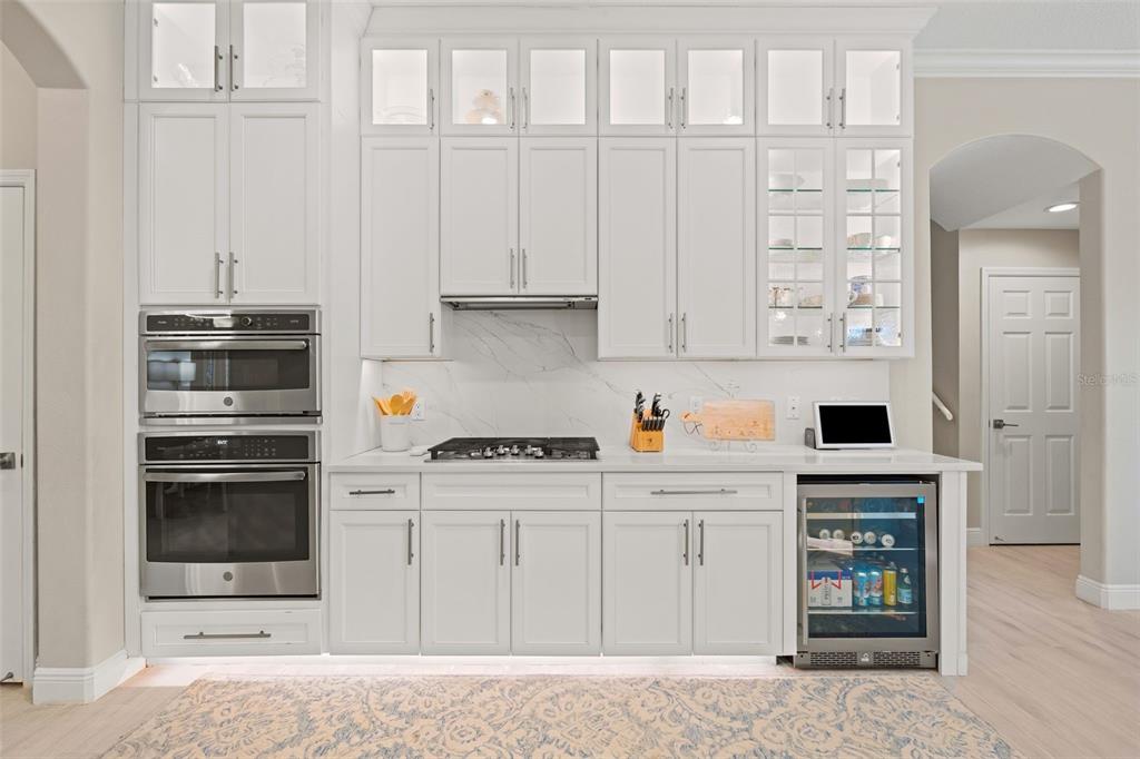 6470 Indigo Bunting Place Lakewood Ranch, FL 34202 - Photo 25 of 65 a kitchen with stainless steel appliances a white cabinets and a sink