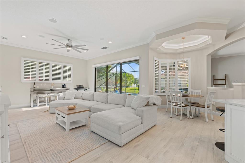 6470 Indigo Bunting Place Lakewood Ranch, FL 34202 - Photo 26 of 65 a living room with furniture and a large window