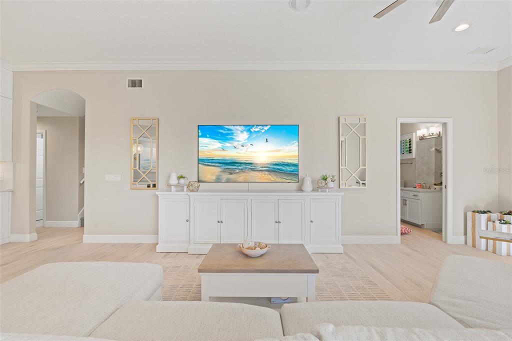 6470 Indigo Bunting Place Lakewood Ranch, FL 34202 - Photo 4 of 65 a living room with furniture and a flat screen tv