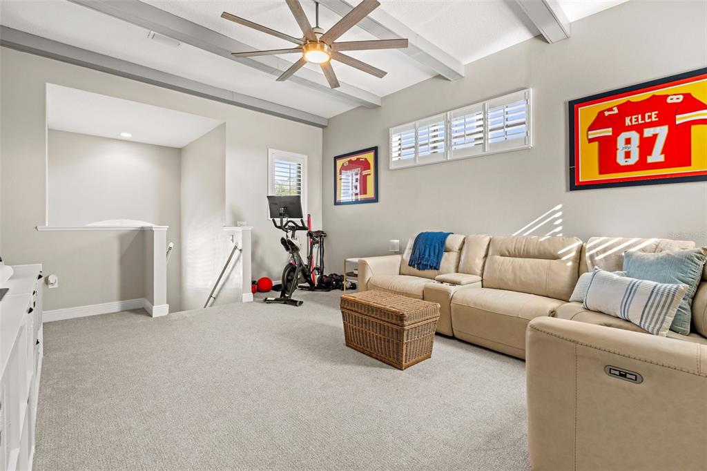 6470 Indigo Bunting Place Lakewood Ranch, FL 34202 - Photo 43 of 65 a living room with furniture and a gym