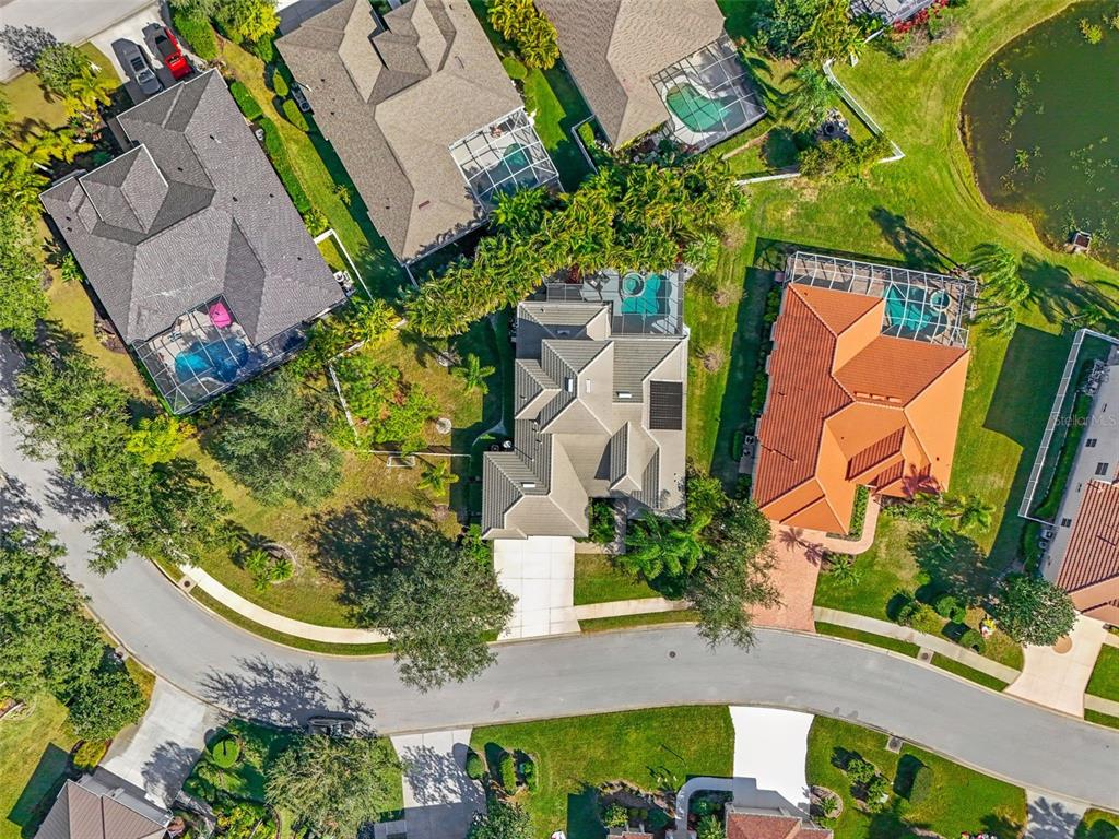 6470 Indigo Bunting Place Lakewood Ranch, FL 34202 - Photo 61 of 65 an aerial view of a house with a yard and garden