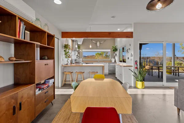 a kitchen with a sink a counter space appliances and cabinets