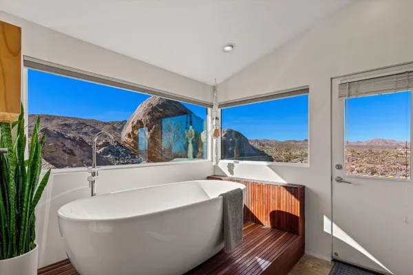 a bathroom with a bathtub and shower
