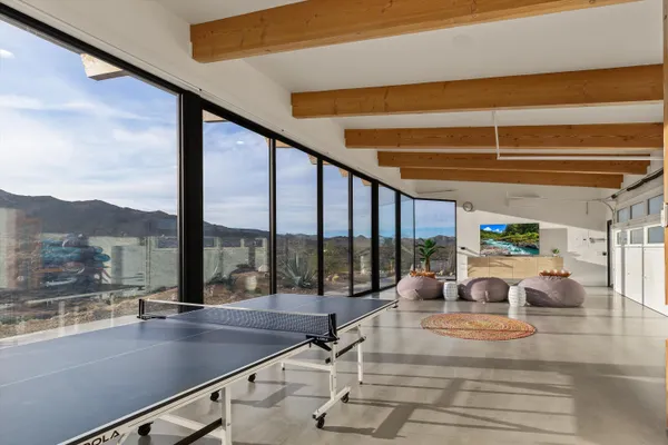 an aerial view of house with yard and mountain view