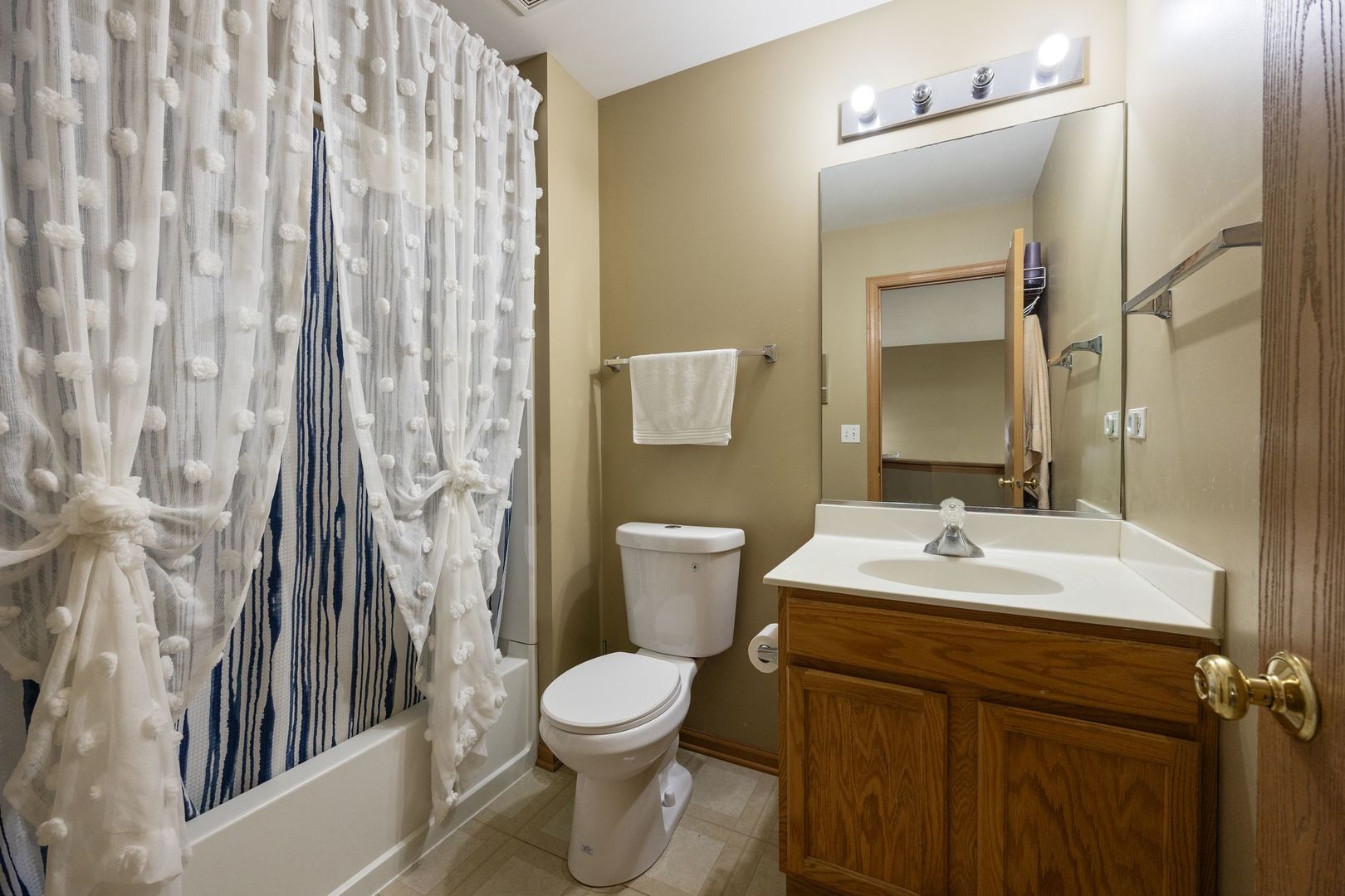 1024 Key Largo Drive Romeoville, IL 60446 - Photo 17 of 25 a bathroom with a sink a toilet and a mirror