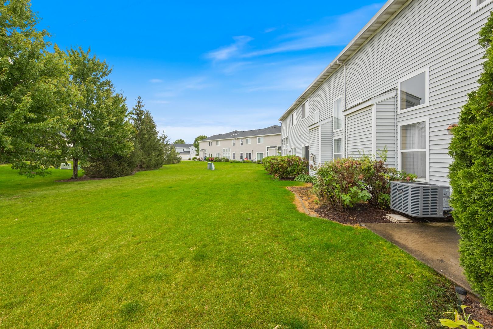 1024 Key Largo Drive Romeoville, IL 60446 - Photo 20 of 25 a view of a house with a back yard