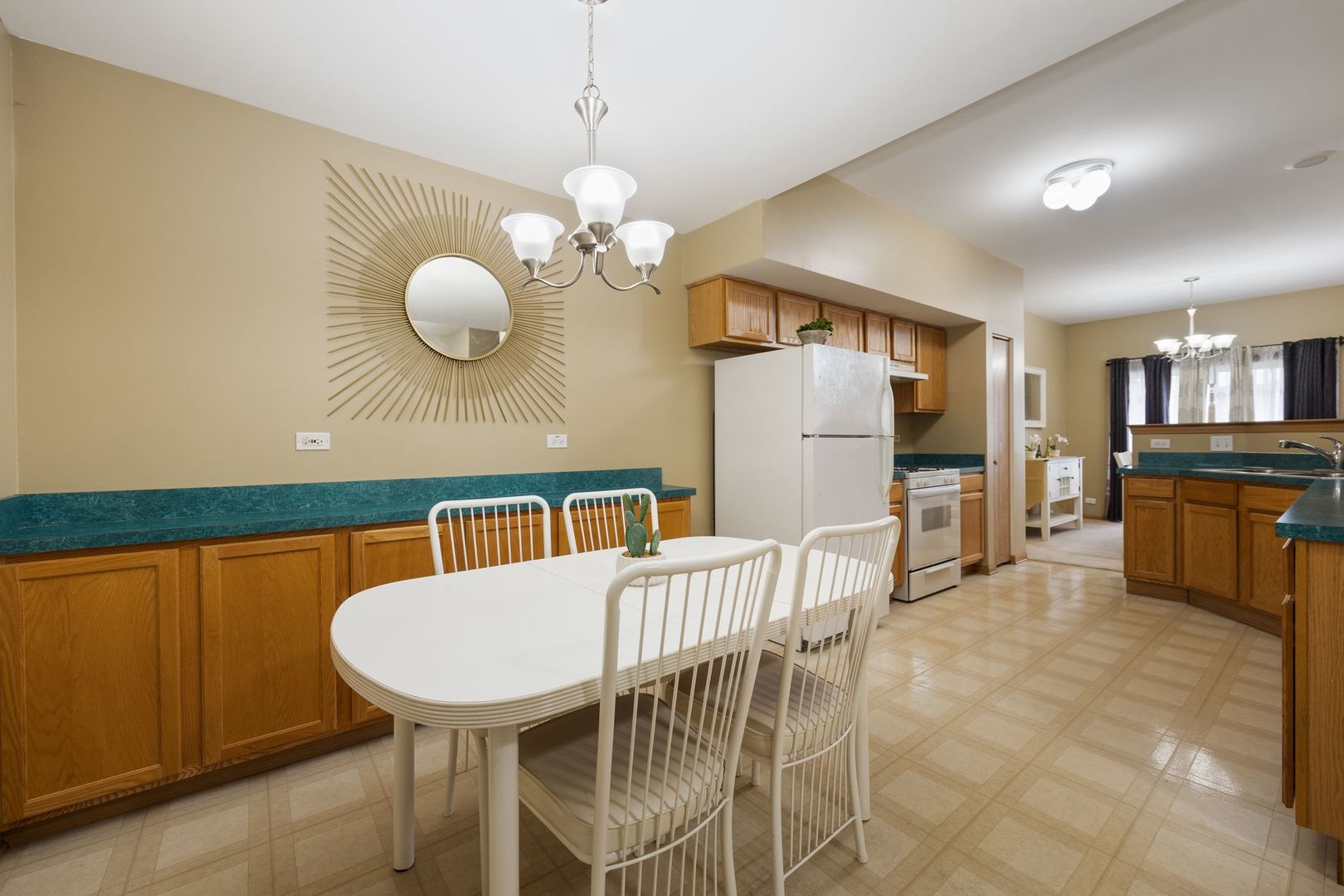 1024 Key Largo Drive Romeoville, IL 60446 - Photo 9 of 25 a view of a dining room with furniture and a chandelier