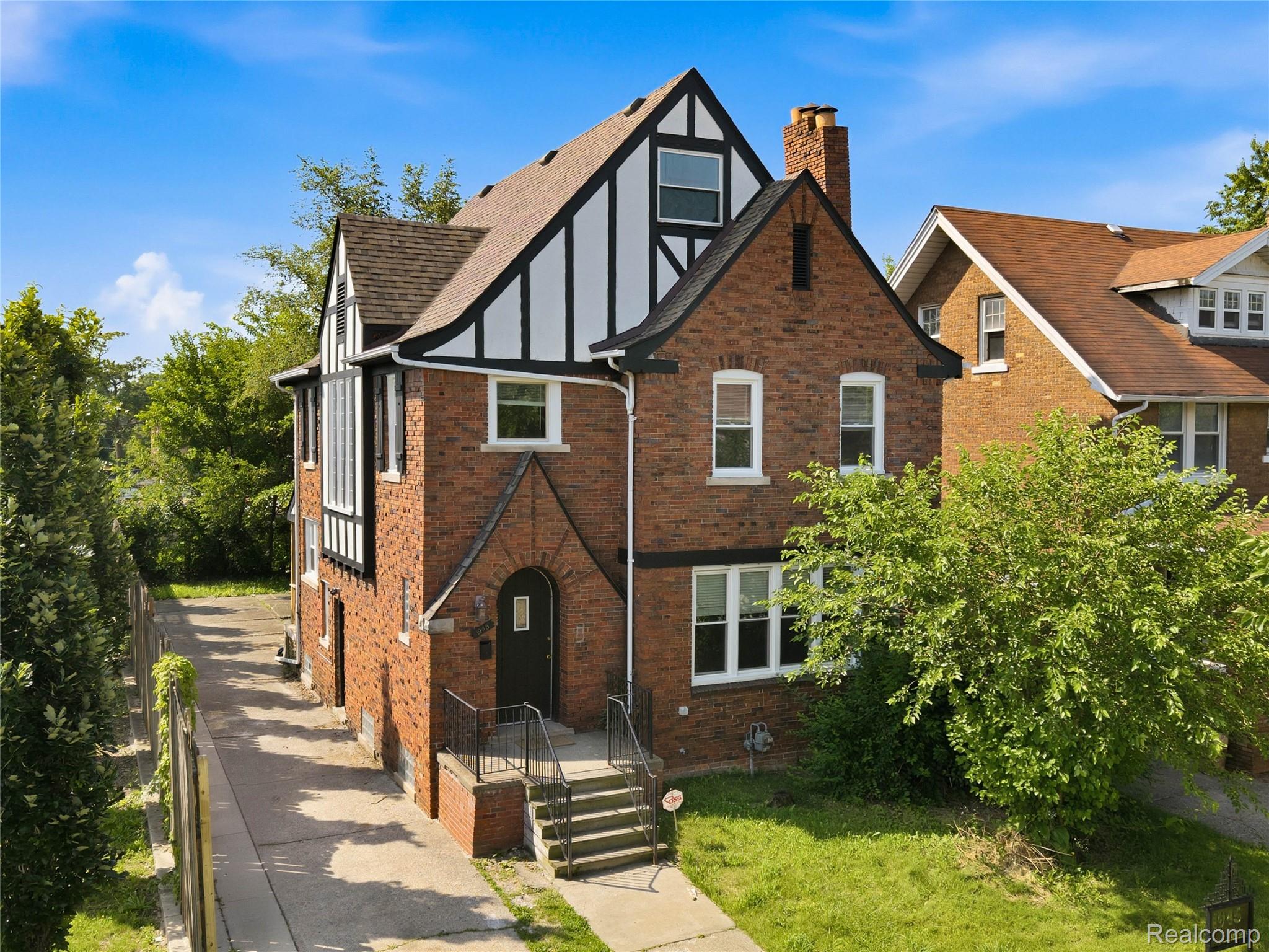 1945 Atkinson Street Detroit, MI 48206 - Photo 1 of 49 Brick and stucco Tudor Revival style exterior with a prominent gabled roofline