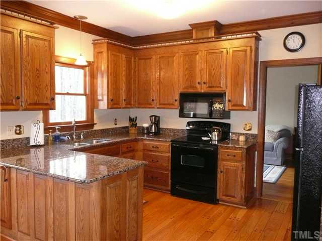 Upgraded kitchen counters with granite. Appiances new in 2008. Custom pegged wood floors in kitchen and powder room Kitchen