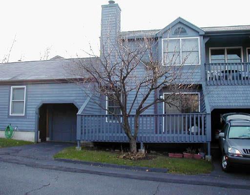 117 Fawn Ridge Lane, Unit 117 Norwalk, CT 06851 - Photo 1 of 1 a front view of a house with garden