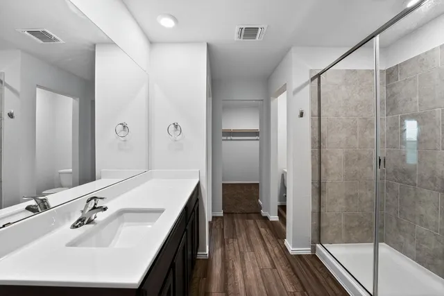 a close up view of a utility room with dryer and washer