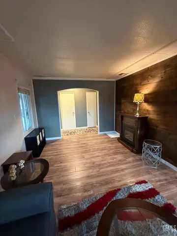 a bedroom with a bed and a television