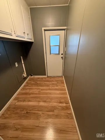 a bedroom with a bed and a mirror