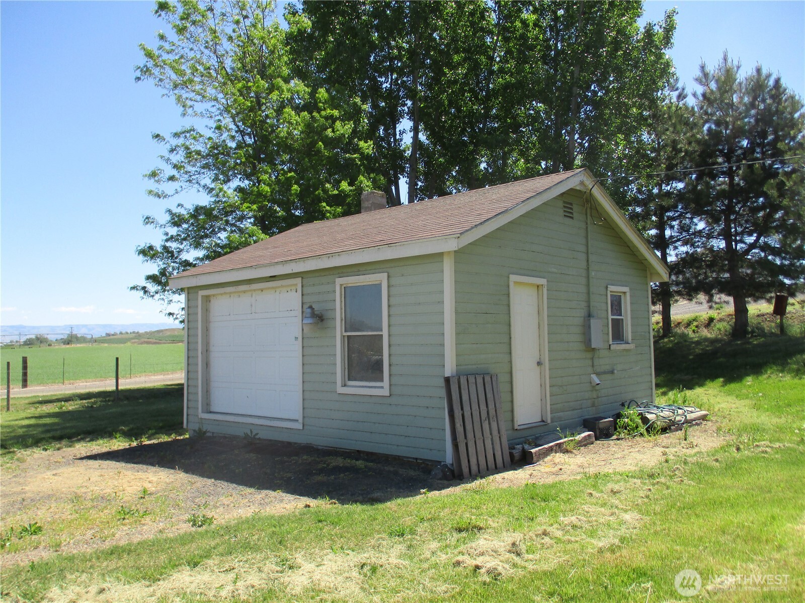 4285 Detour Road Touchet, WA 99360 - Photo 13 of 15 a front view of house with yard and trees in the background