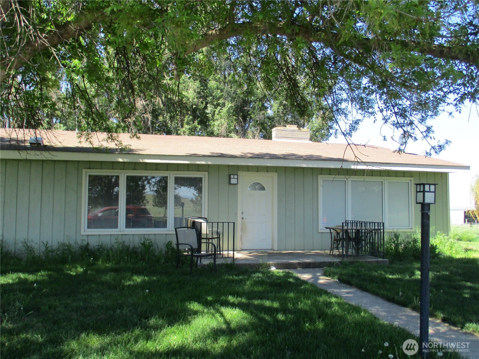 4285 Detour Road Touchet, WA 99360 - Photo 9 of 15 a view of a house with a yard potted plants and a table