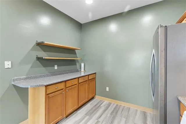 a room with a sink and cabinets