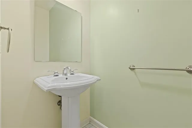 a bathroom with a sink and mirror
