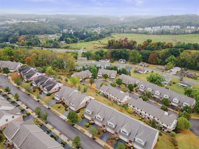 an aerial view of a city with mountains