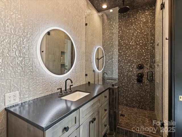 a living room with furniture dining table and a chandelier