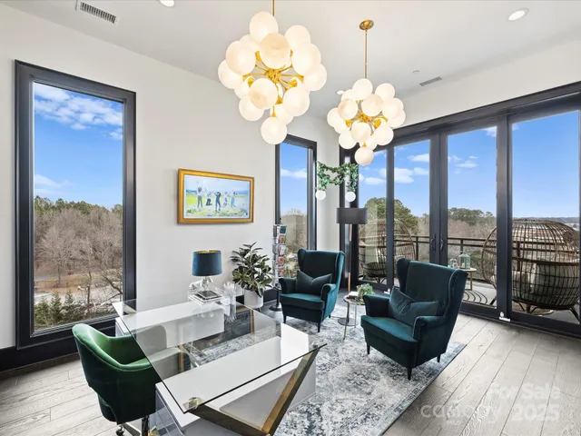 a bedroom with a bed table flowerpot and window