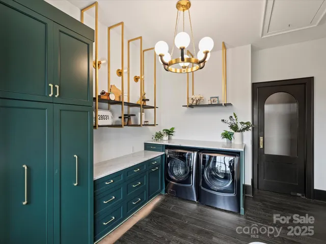 a living room with furniture and stairs