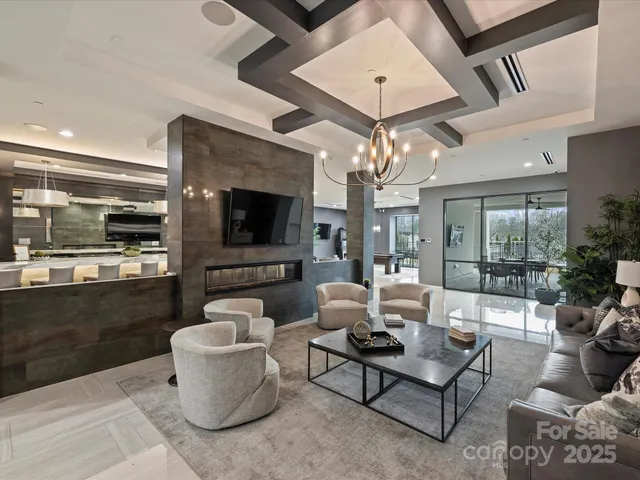 a large kitchen with a table and chairs