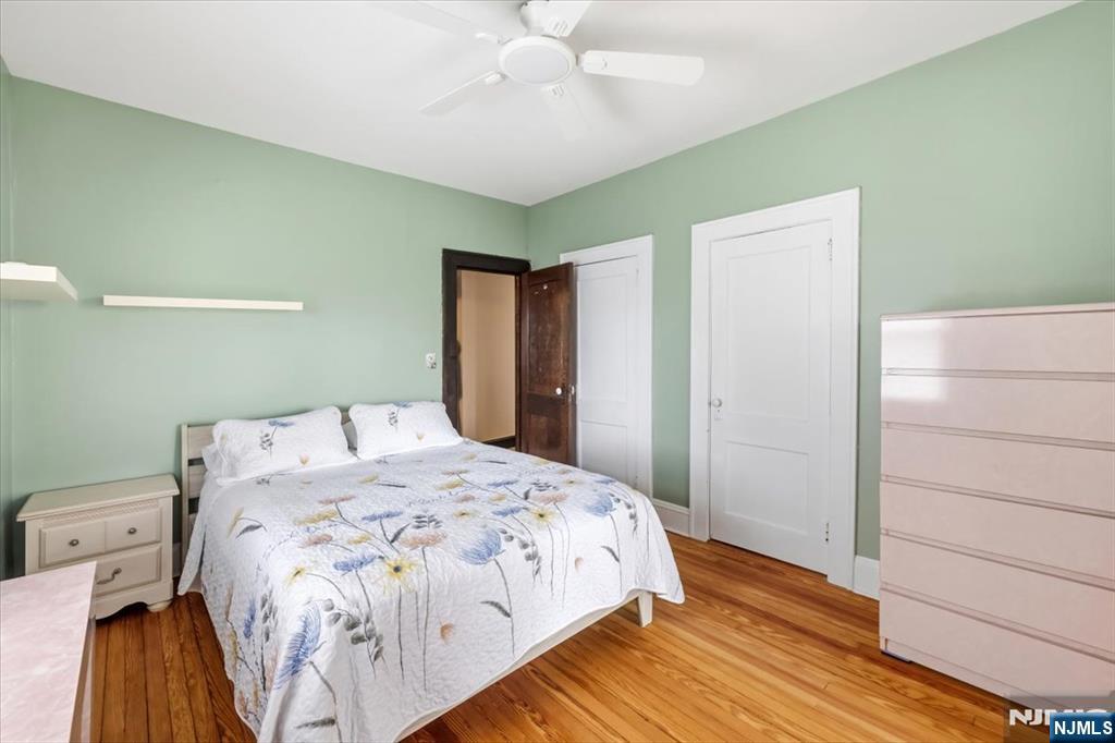 119 Overpeck Avenue Ridgefield Park, NJ 07660 - Photo 14 of 44 a bedroom with a bed and a walk in closet