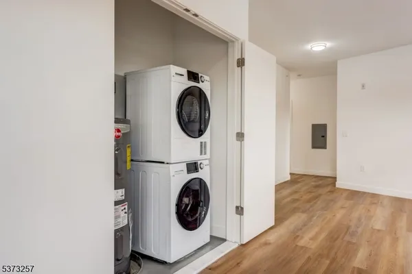 a view of a hallway with washer and dryer