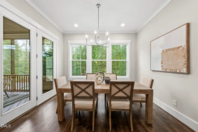 a kitchen with granite countertop a sink a counter top space and living room view