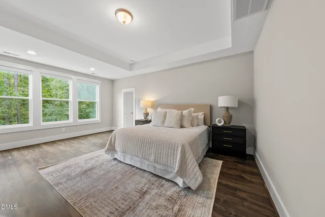 a view of a patio with a table chairs and a balcony