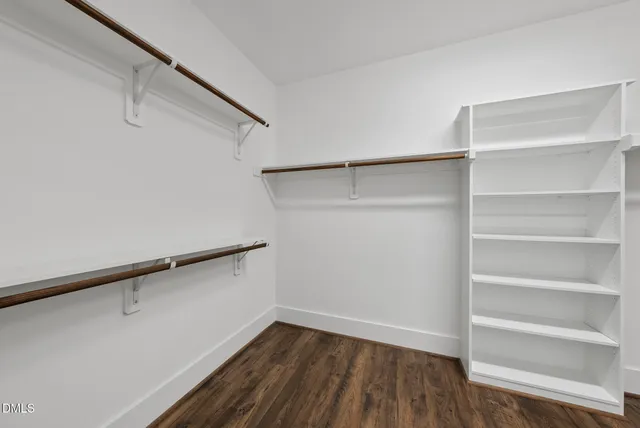 a bathroom with a double vanity sink mirror and shower