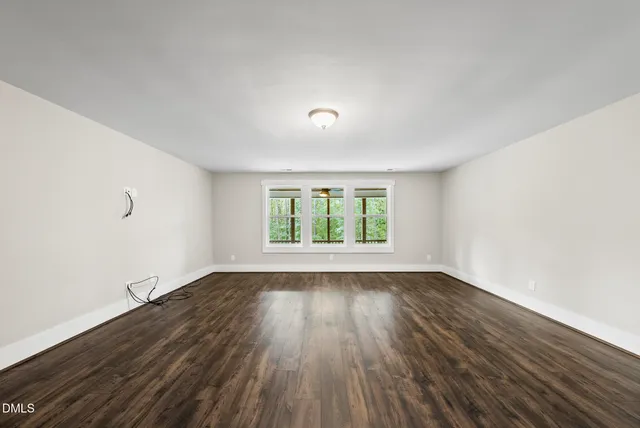 a view of balcony with wooden floor