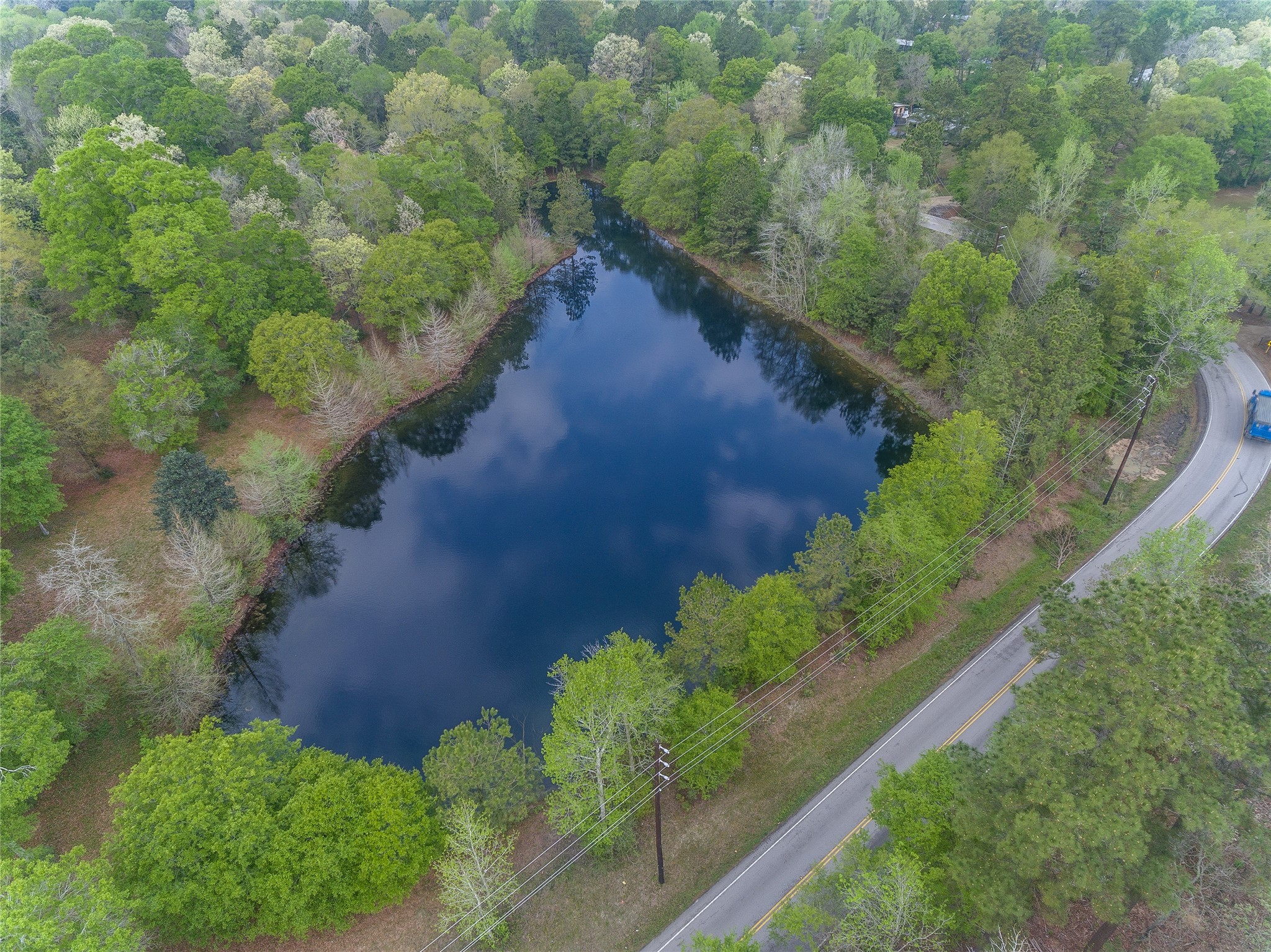 Tbd Tbd Firetower Road Conroe, TX 77306 - Photo 22 of 23 a view of a lake with a yard