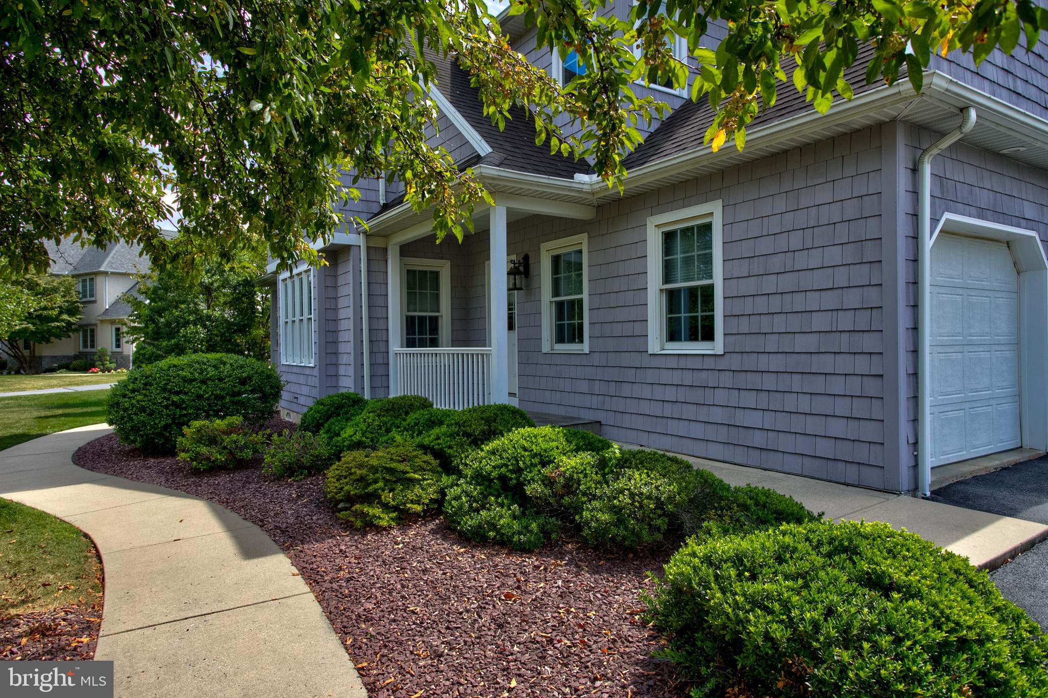382 Rumford Road Lititz, PA 17543 - Photo 2 of 63 a view of brick house with a large windows plants and large trees